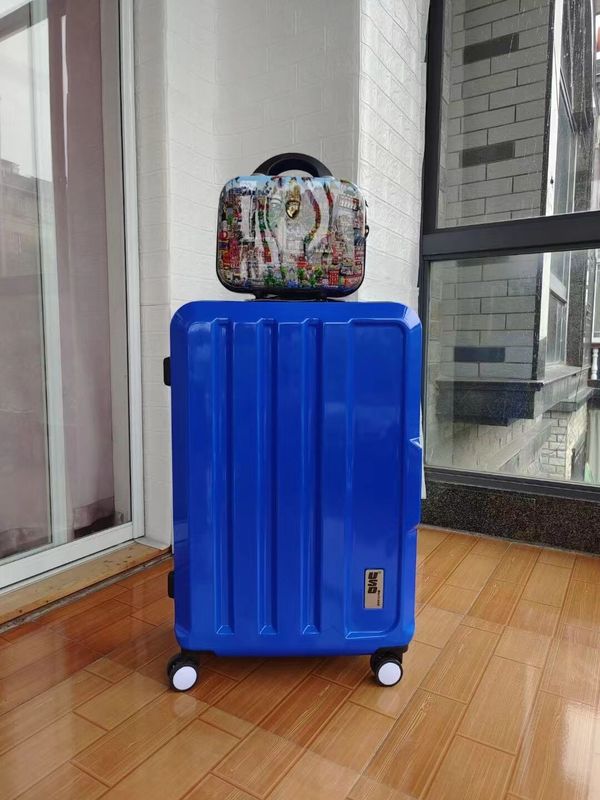 China de alta calidad fábrica colorido nuevo diseño cascarón duro inoxidable regalo conjunto Abs por mayor maleta cremallera tiempo de viaje