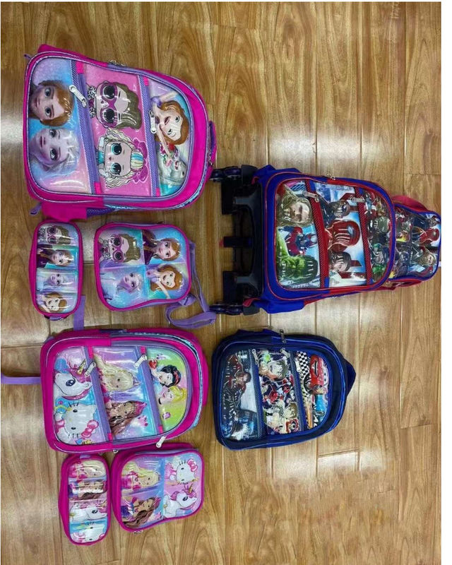 Nueva venta al por mayor de mochilas de tres piezas para estudiantes de primaria grados 2-3 5-6 bolsas de cuero de dibujos animados
