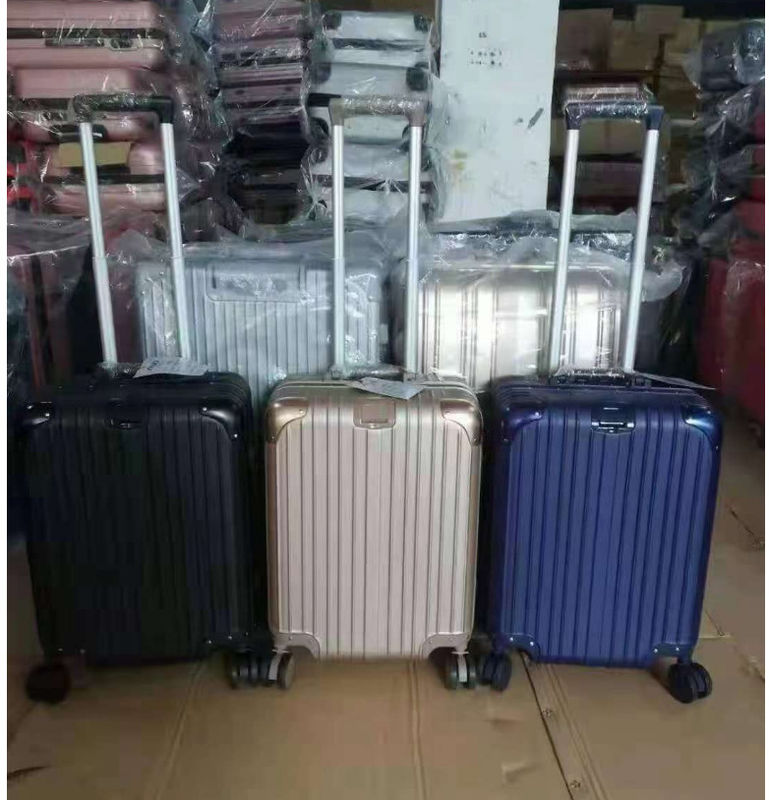Nueva última maleta de viaje ABS + PC Universal Rueda de cremallera de carrito Caja de arrastre de cuero Caja de código Caja de equipaje mayorista