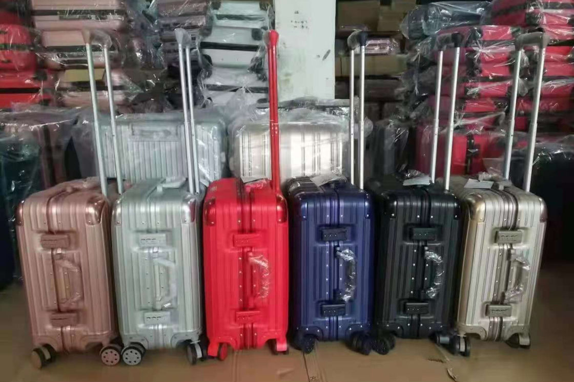 Nueva última maleta de viaje ABS + PC Universal Rueda de cremallera de carrito Caja de arrastre de cuero Caja de código Caja de equipaje mayorista